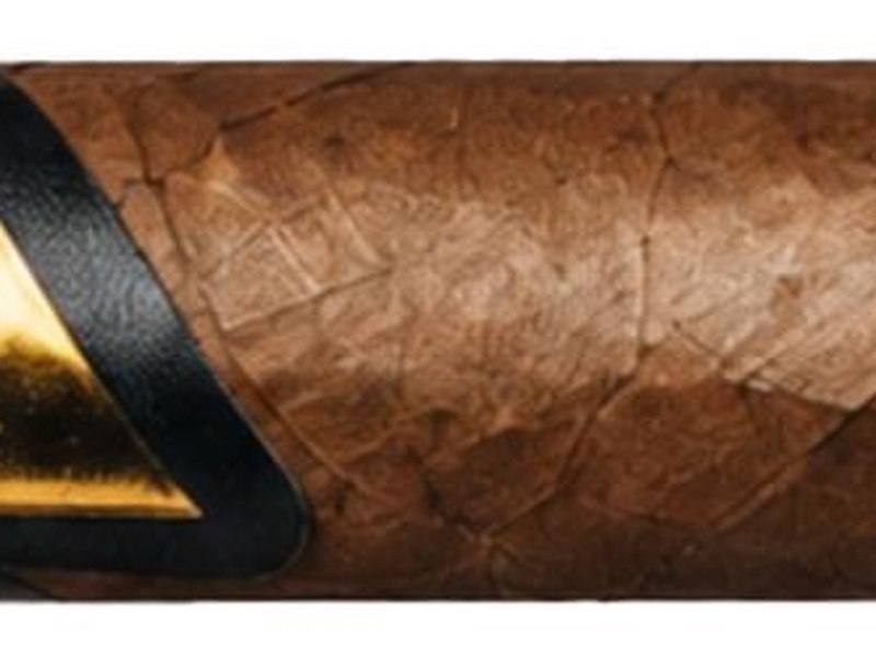 A Beast Mode by Kingmakers cigar with a gold and black band and a black foot band