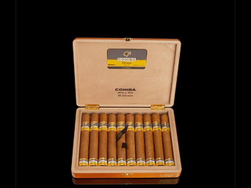 An open box of ten Cohiba Talisman cigars with yellow and black bands, in Habanos’ launch photography