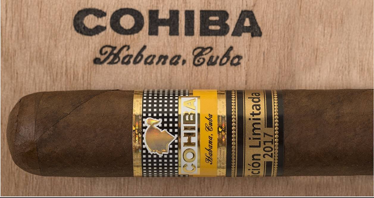 A single Cohiba Talisman Edicion Limitada 2017 cigar with its band, photographed against a wooden box