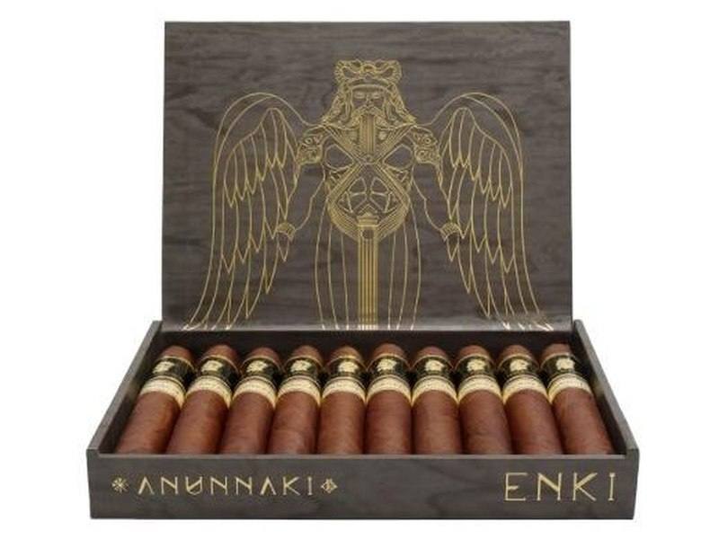 An open box of Don Emmanuel Anunnaki Enki cigars with a winged gold figure on the lid, the box branded Anunnaki Enki