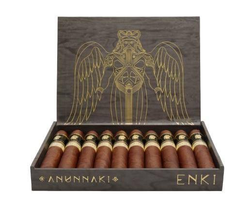 An open box of Don Emmanuel Anunnaki Enki cigars with a winged gold figure on the lid, the box branded Anunnaki Enki