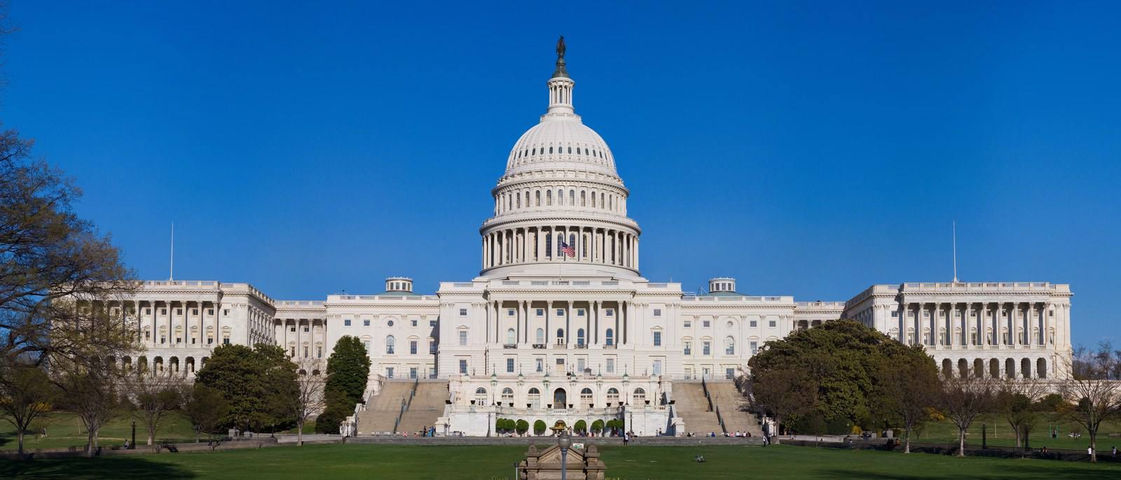The west front of the United States Capitol under a clear sky