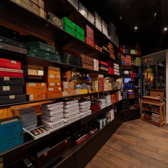 Shelves of cigar boxes inside a German cigar retailer’s walk-in humidor