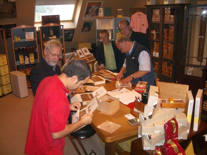 Customers browsing cigar boxes inside La Casa del Habano in Koln