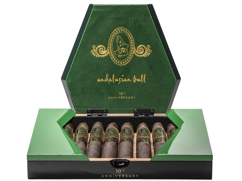 An open green and gold box of La Flor Dominicana Andalusian Bull 10th Anniversary Maduro cigars