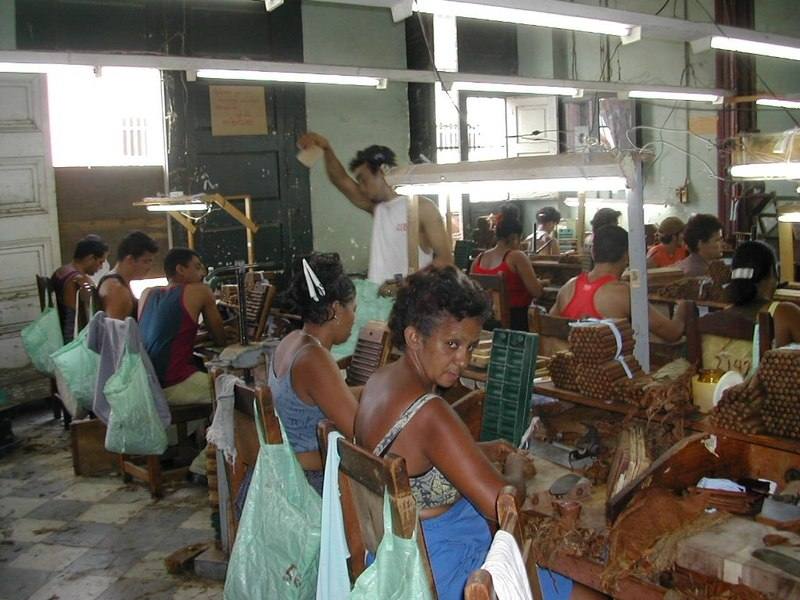 Cigar rollers at work on a factory floor in Trinidad, Cuba