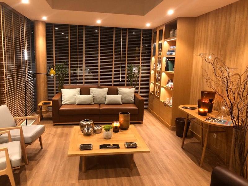 Modern cigar lounge with a leather sofa, coffee table and display cabinets