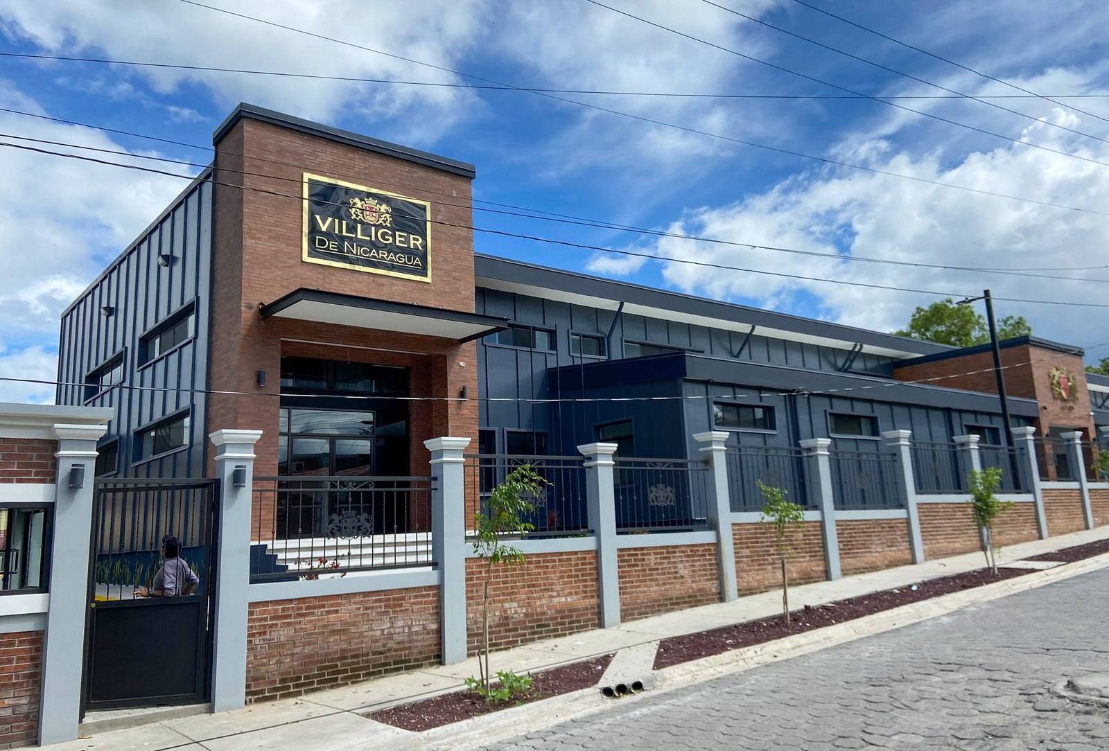 The brick and steel facade of the Villiger de Nicaragua factory in Esteli, with its gold Villiger sign