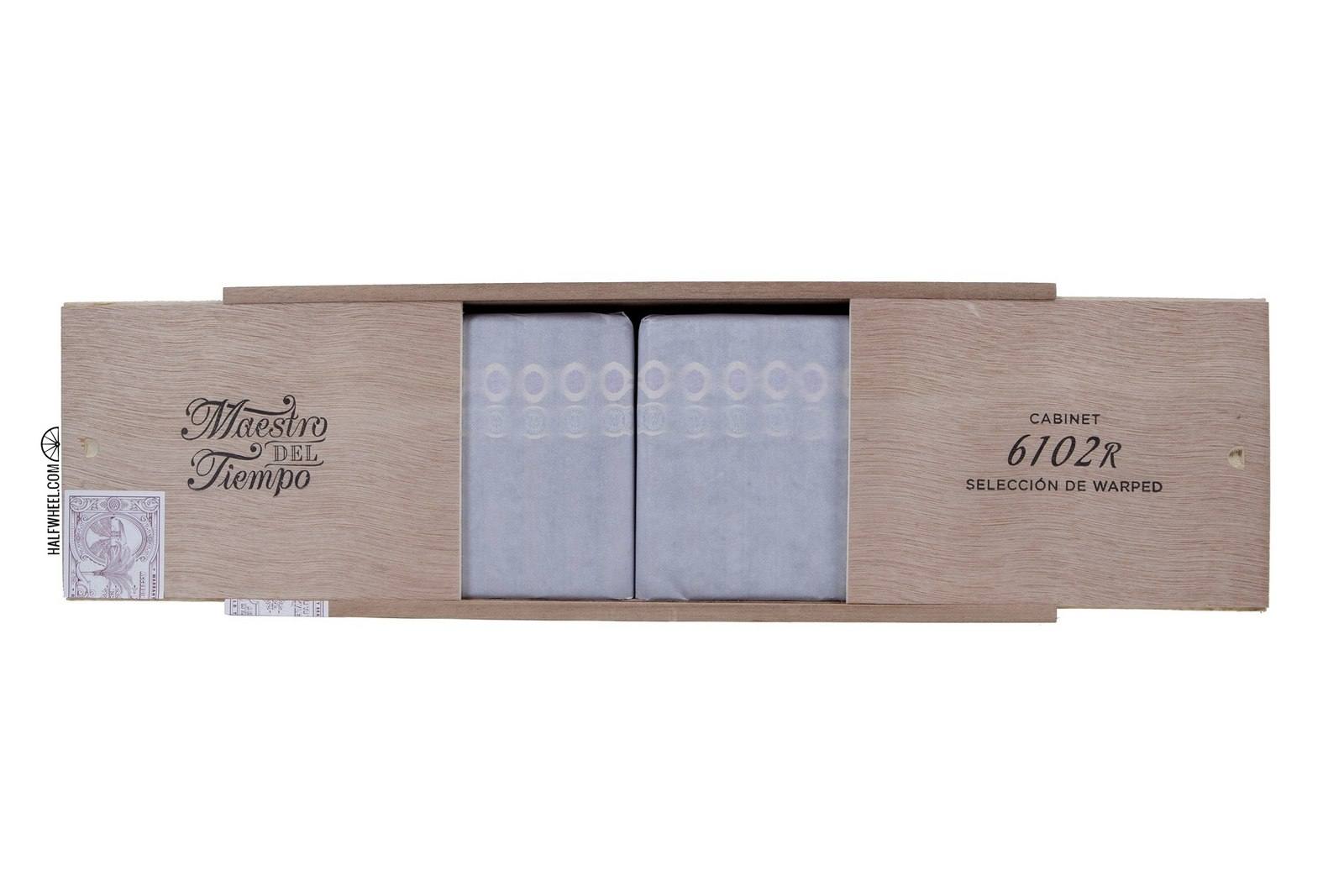 The open wooden Maestro del Tiempo 6102R cabinet with cigars under tissue paper, photographed by halfwheel